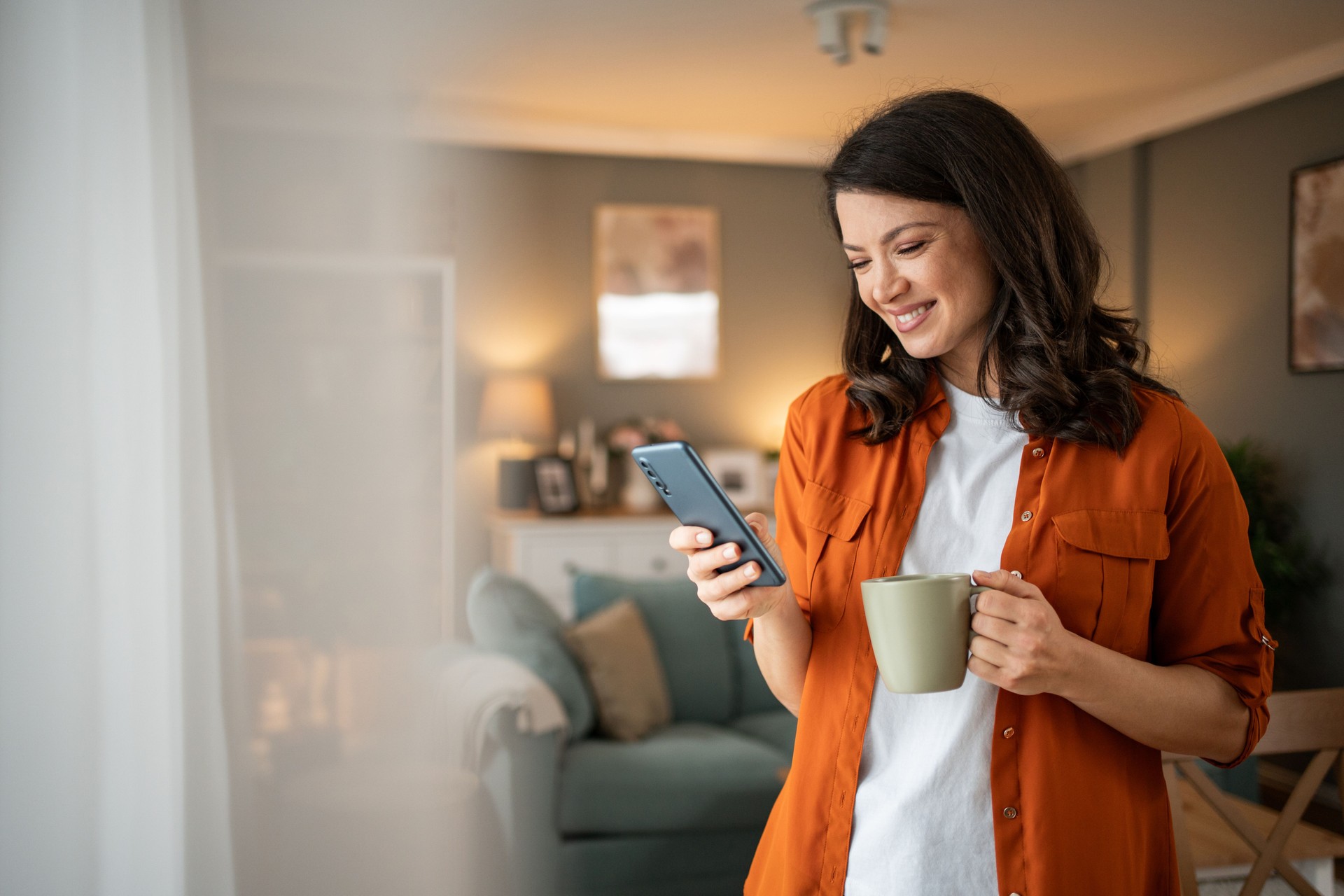 Soothing rhythm of the morning - A young woman enjoys her morning coffee